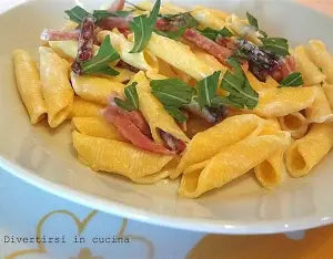 Chiacchiere speck, rucola e grana